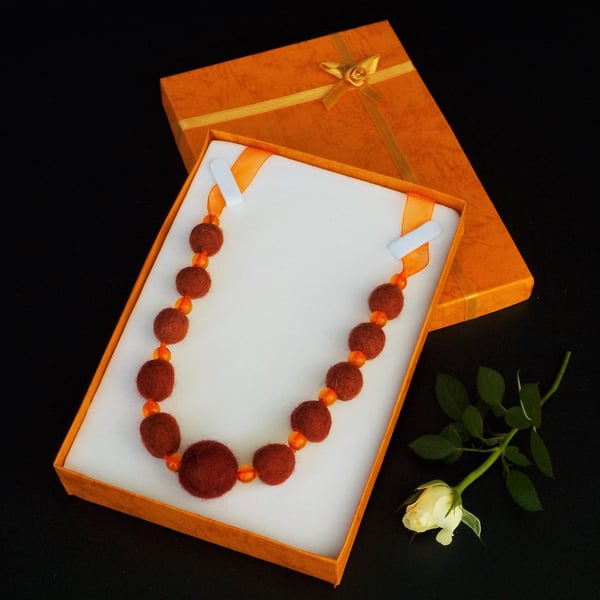 Handmade felt necklace burnt orange and russet beads in gift box.