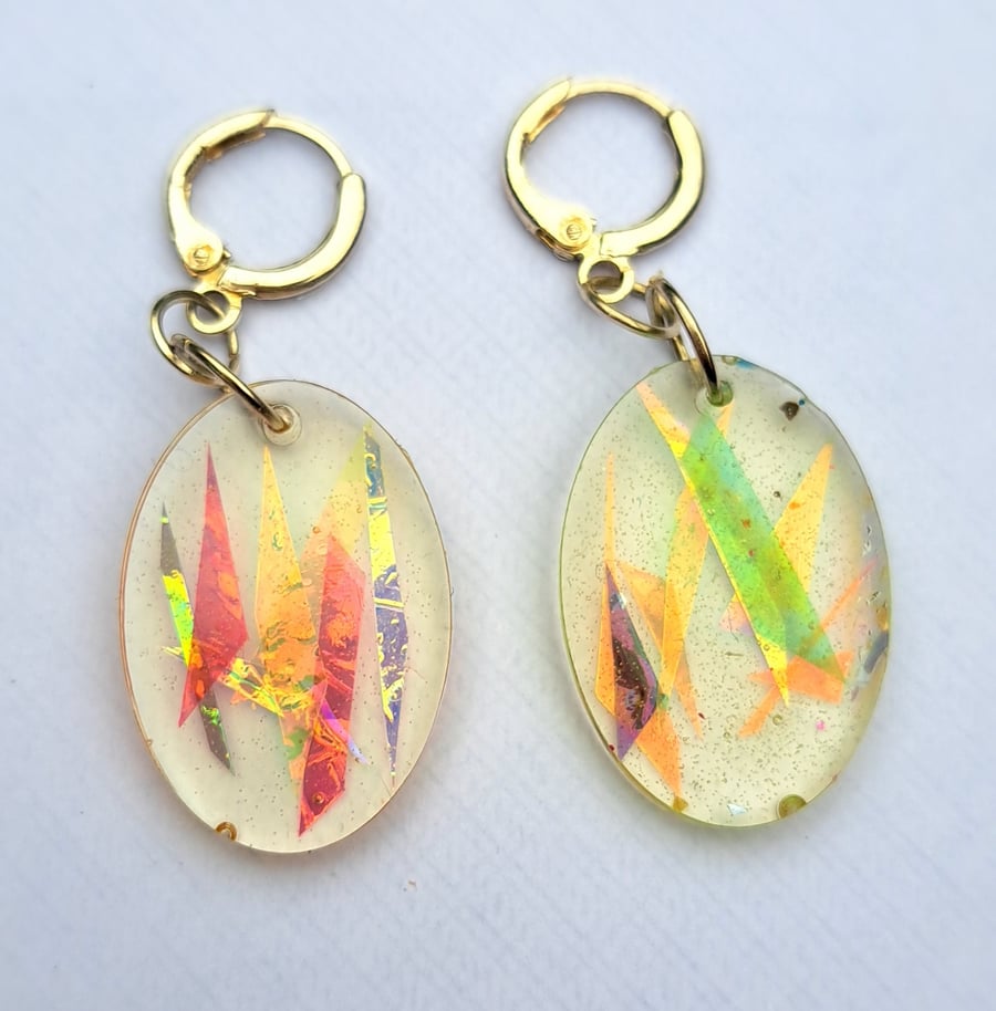 Super sparkly pair of egg shaped resin earrings with dichroic film strips