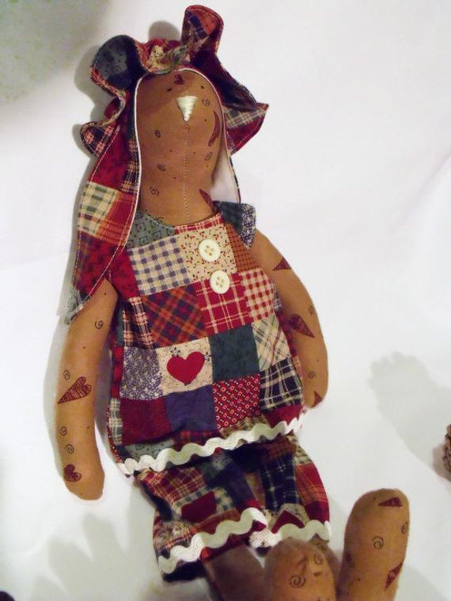 Tilda style tan primitive bunny rabbit doll for display, faux patchwork outfit