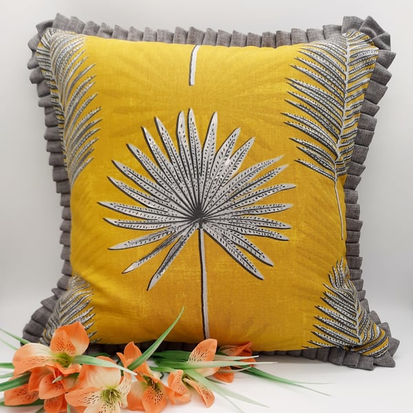 Yellow and grey cushion cover with pleated edge.  