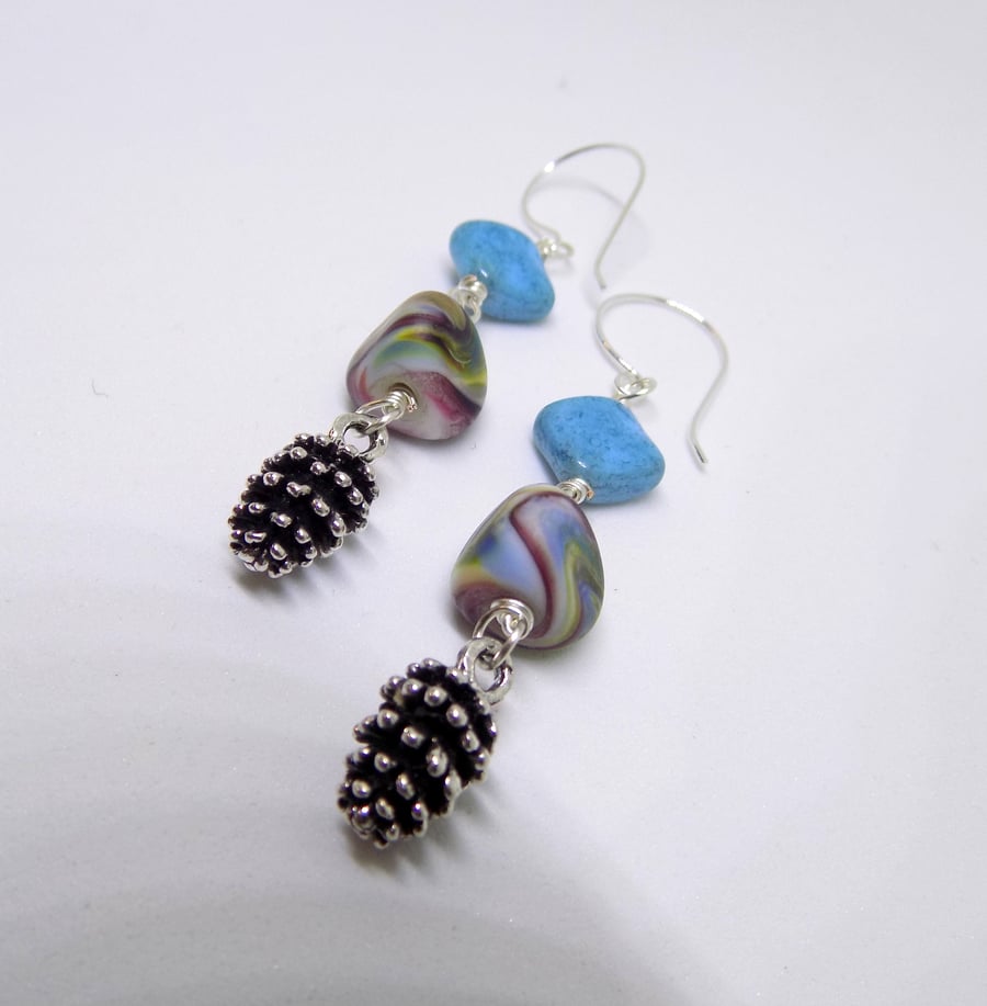 Lamp work bead and pine cone charm dangle earrings