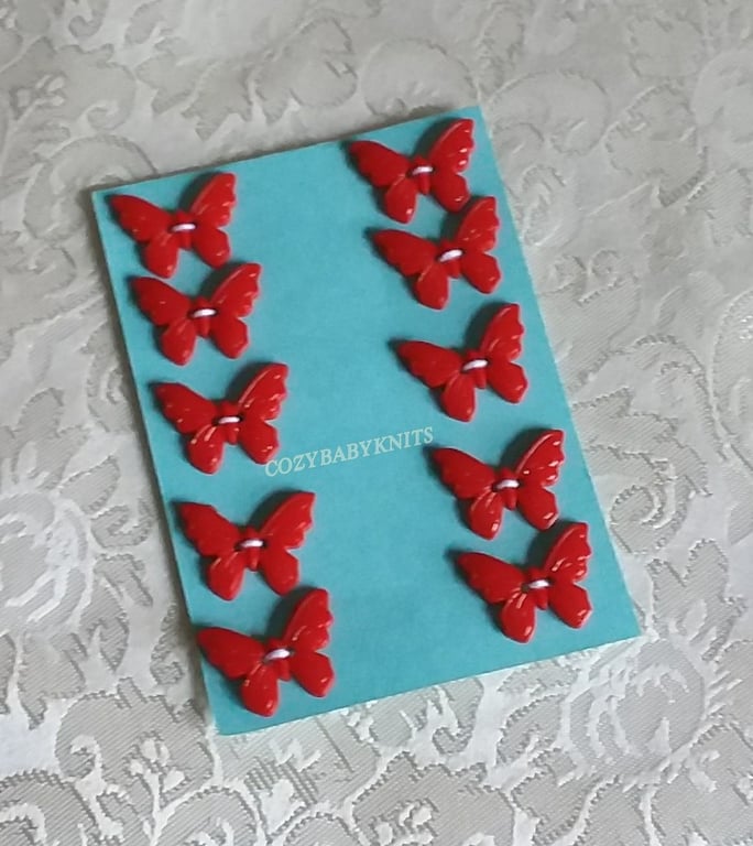 RED PLASTIC BUTTERFLY BUTTONS WITH TWO HOLES FOR ATTACHING 