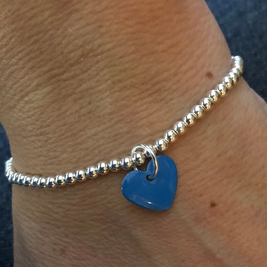  Mid blue enamel heart on silver beaded stretch bracelet. Stacking bracelet.