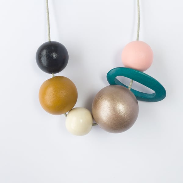 Hattie - Modern wooden bead necklace, green oval shaped bead, pale pink, mustard