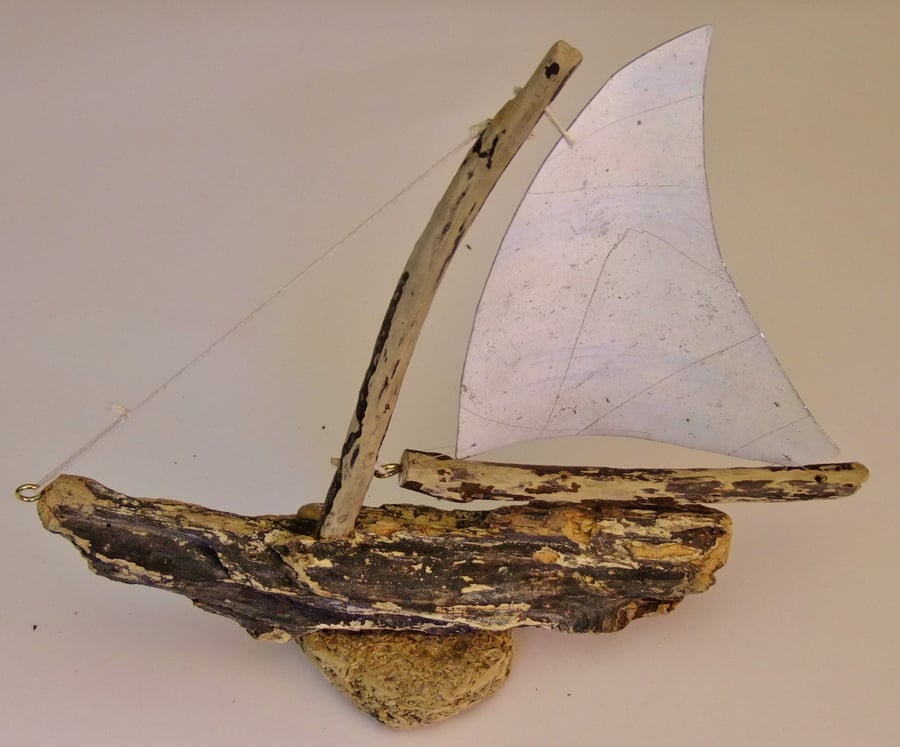 DRIFTWOOD YATCH OR SAILING BOAT WITH ALUMINIUM SAILS.