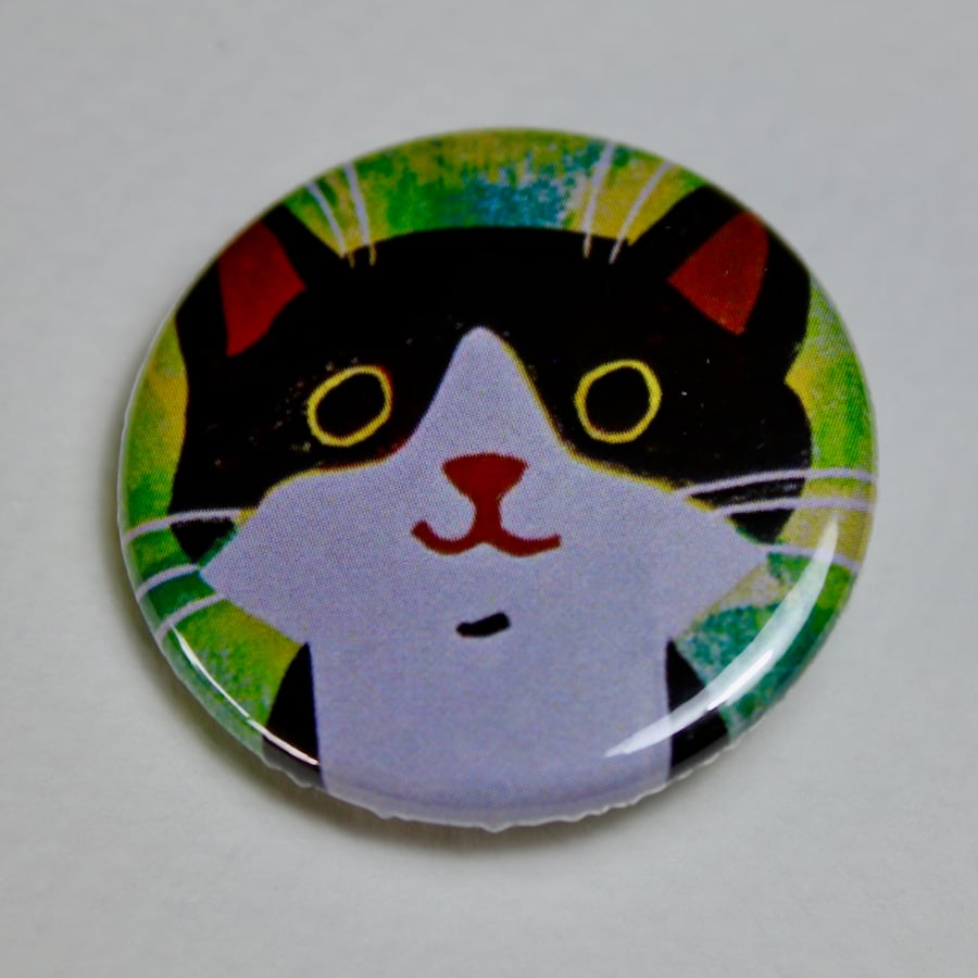 LITTLE BLACK AND WHITE CAT ON GREEN BADGE 