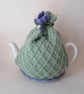 Tea cosy tea cosie - knitted pastel green with crocus flowers - Image 1