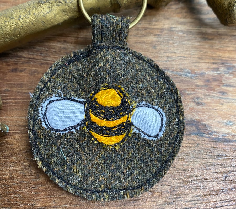 Up-cycled bumble bee plaid key ring or bag charm. 