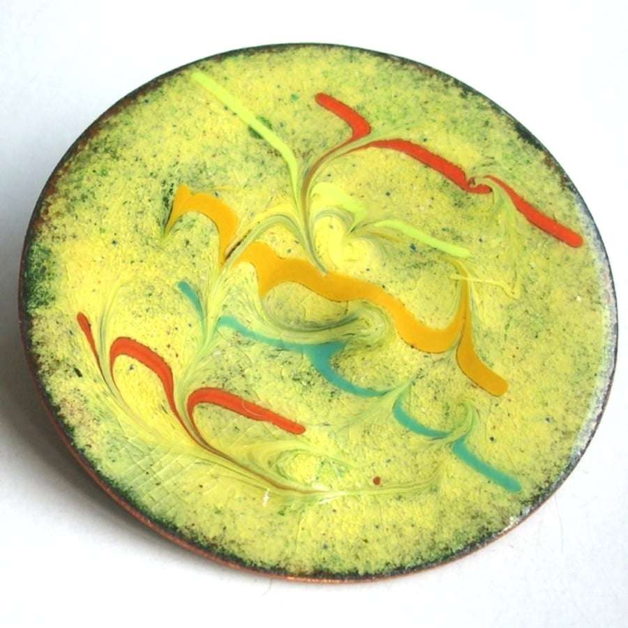 large round brooch - scrolled red, yellow and turquoise over gold