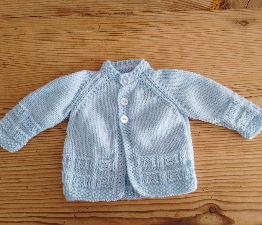 Handmade blue round necked baby cardigan age 0-3 months.
