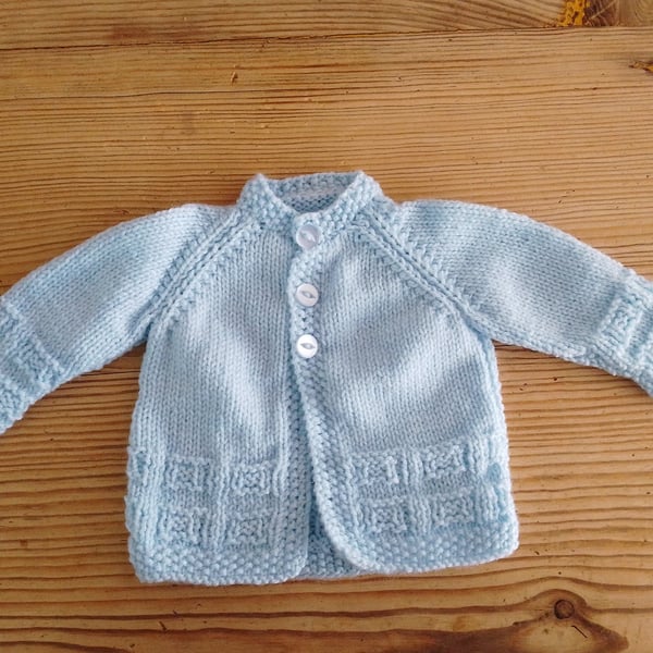 Handmade blue round necked baby cardigan age 0-3 months.