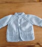 Handmade blue round necked baby cardigan age 0-3 months.
