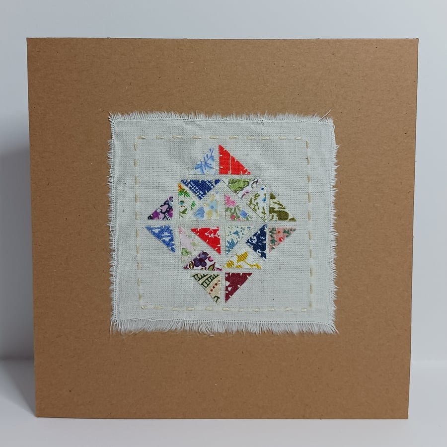 A Rainbow Patchwork of vintage fabrics hand stitched card