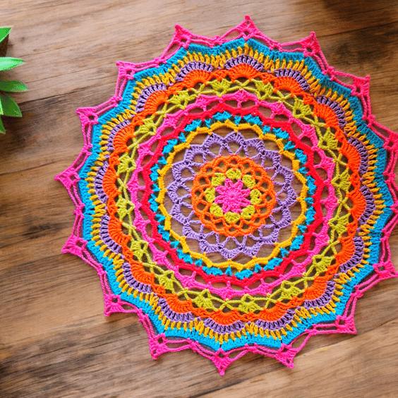 Large, bright crochet mandala doily table mat