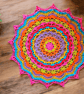 Large, bright crochet mandala doily table mat