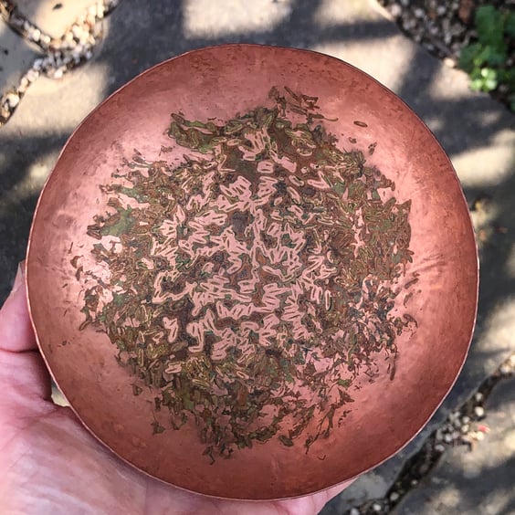 Hand raised copper bowl with patinated interior.