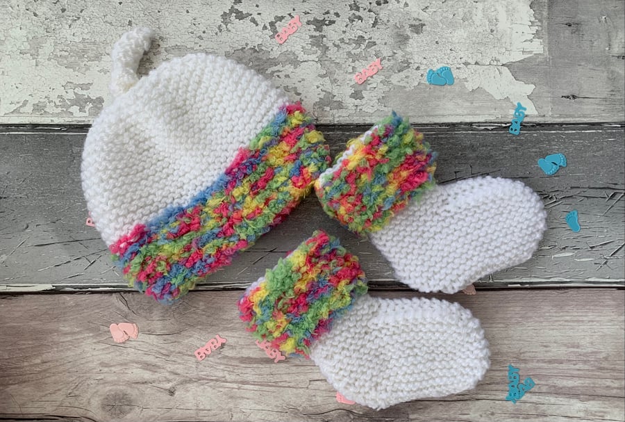 Knitted baby booties and matching hat set 