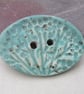 Large Eggshell Oval Seedhead Handmade Ceramic Button - Image 1
