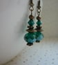 GREEN & ANTIQUE BRONZE DANGLE EARRINGS.  1035 - Image 1