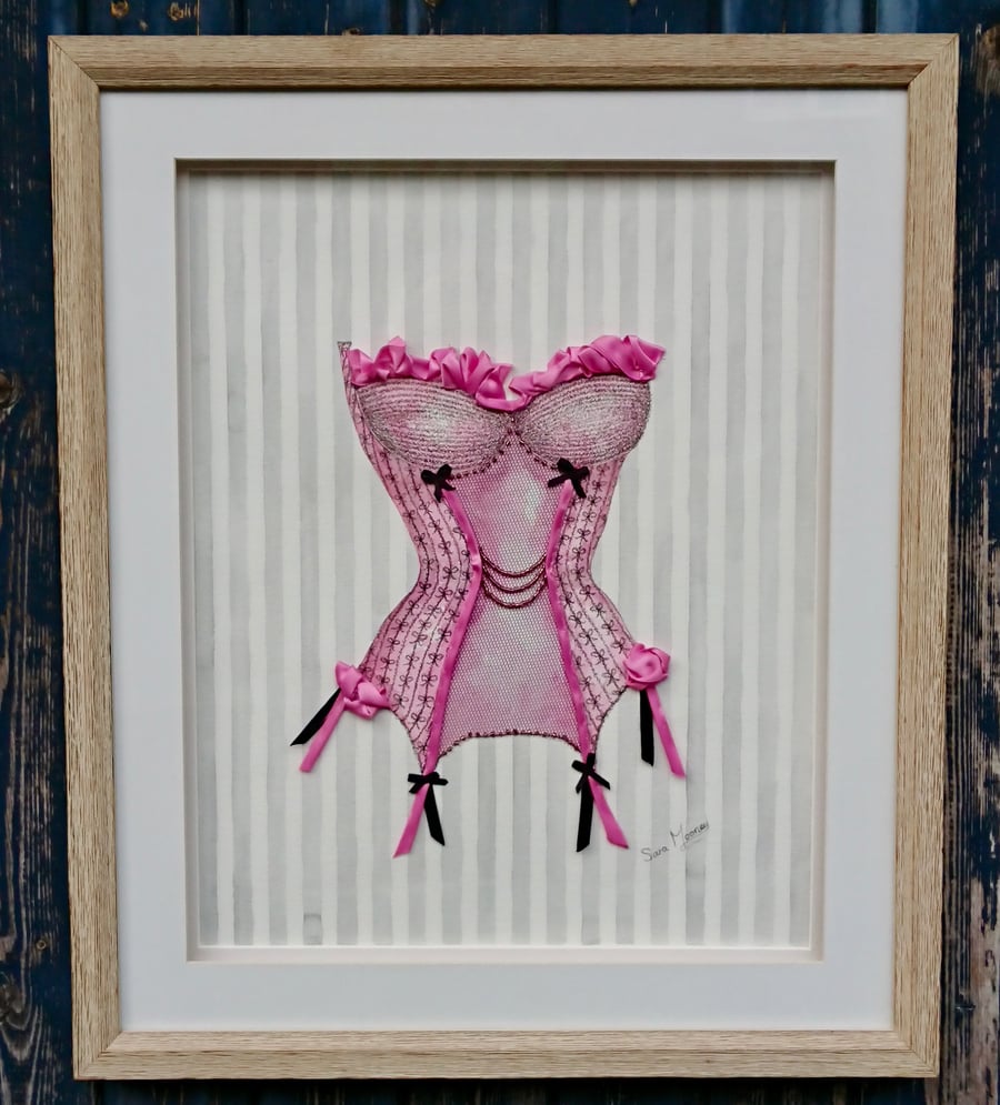 Pink and black corset painting with hand-stitched ribbon, net, and beadwork.