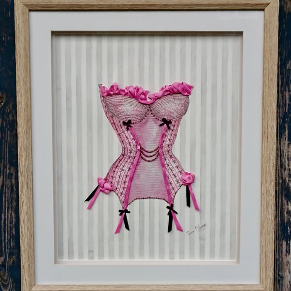 Pink and black corset painting with hand-stitched ribbon, net, and beadwork.