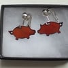 Small pig, clip-on earrings - red over clear