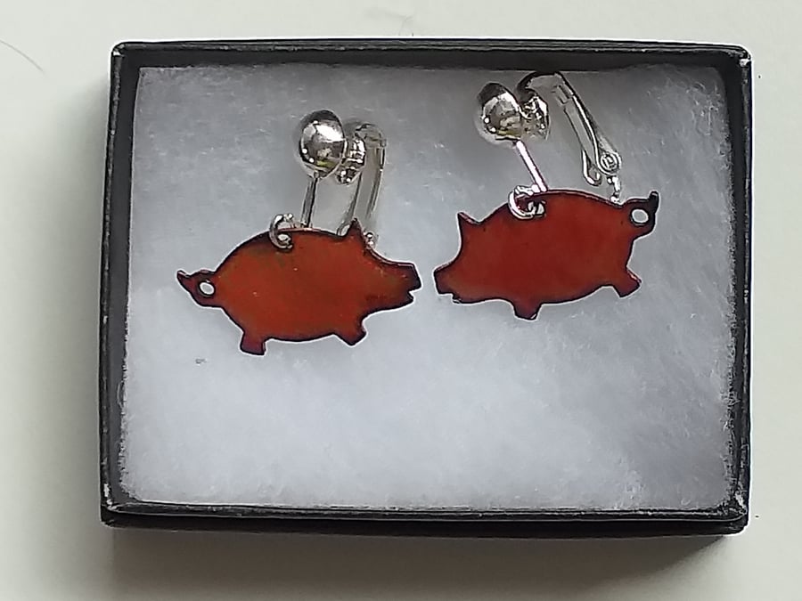 Small pig, clip-on earrings - red over clear
