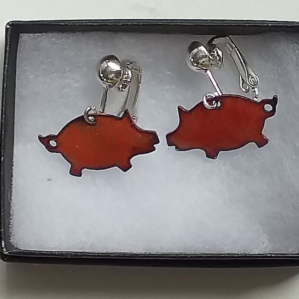 Small pig, clip-on earrings - red over clear