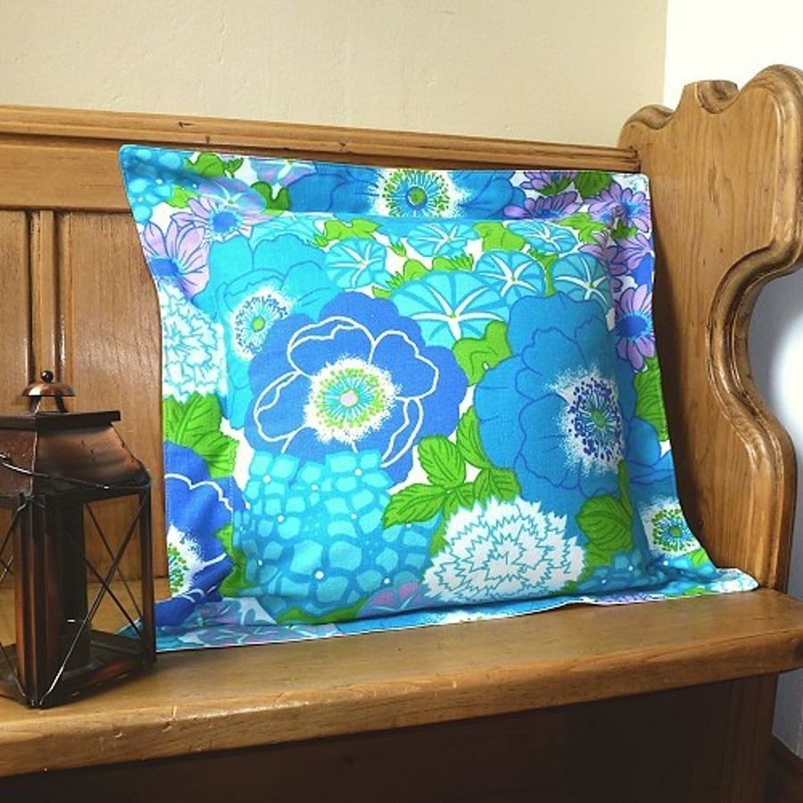 A pair of 1970s, hippy style, floral cushion covers (blue, lilac, green & white)