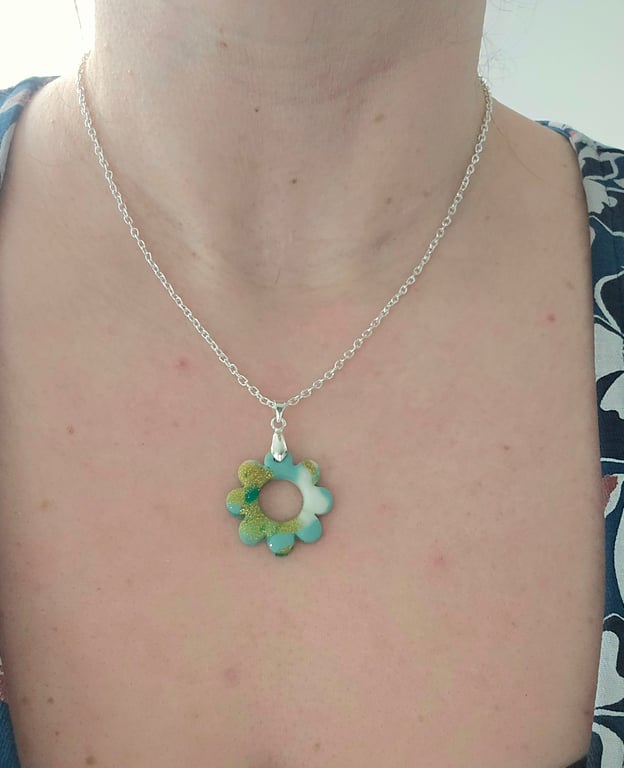 Polymer green and gold flower necklace on a silver plated chain