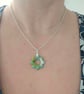 Polymer green and gold flower necklace on a silver plated chain