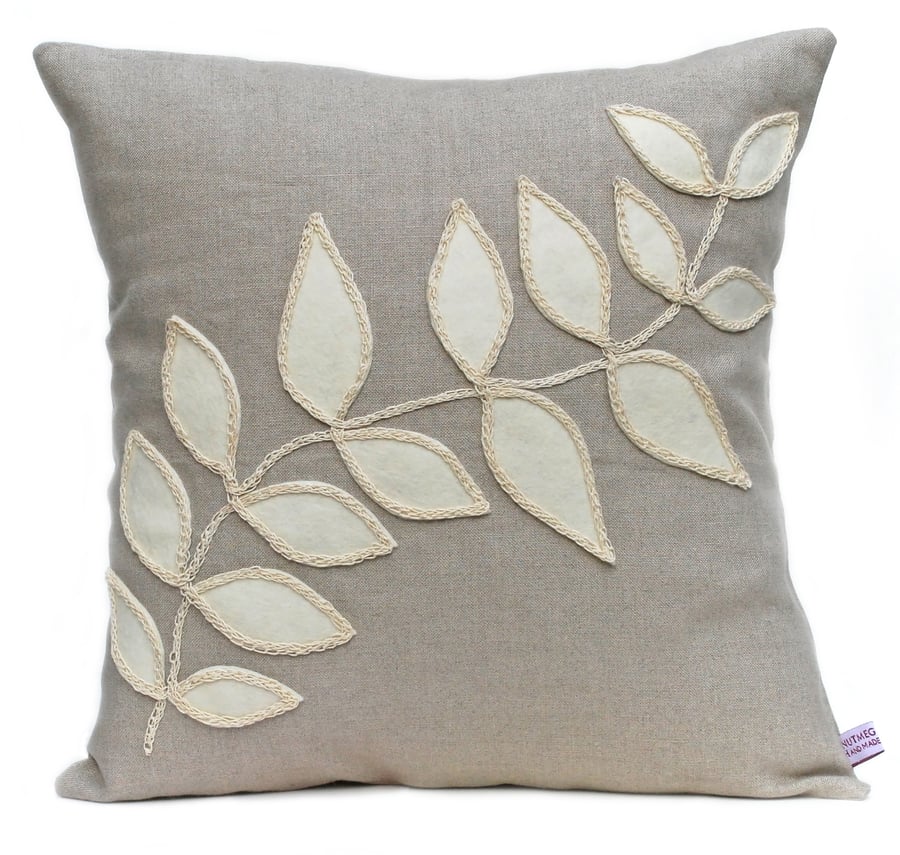 Linen cushion with cream leaf design