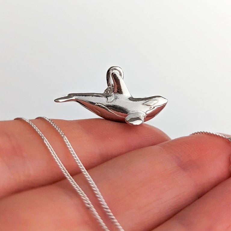 Solid Sterling Silver tiny realistic orca pendant.