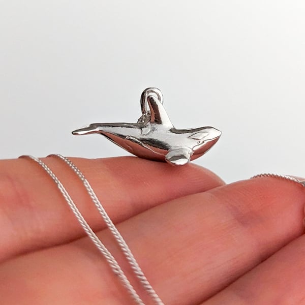 Solid Sterling Silver tiny realistic orca pendant.