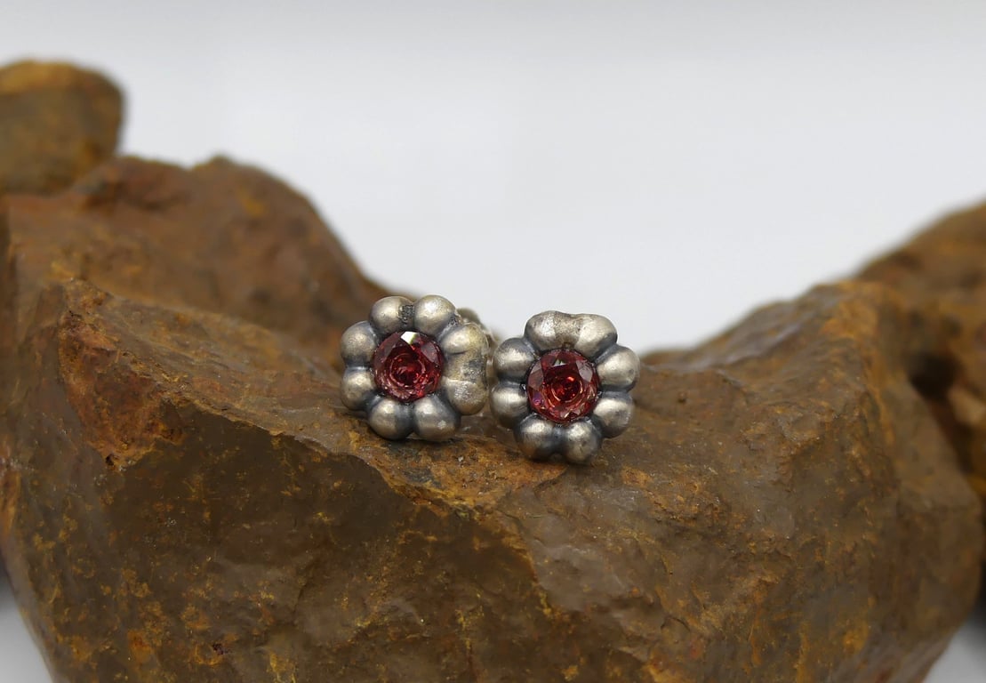 Recycled Sterling Silver Flower Stud Earrings with 4mm Garnet Gemstones.