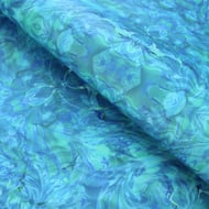 Printed marbled wrapping paper in blue green rippling water