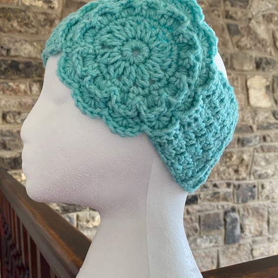 Women's flower ear warmer in green & purple acrylic yarn