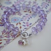 Rondelle bracelet with heart & flower charm (purple)