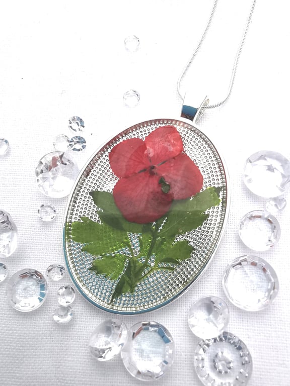 Oval Resin Pendant With Red Flower Petals