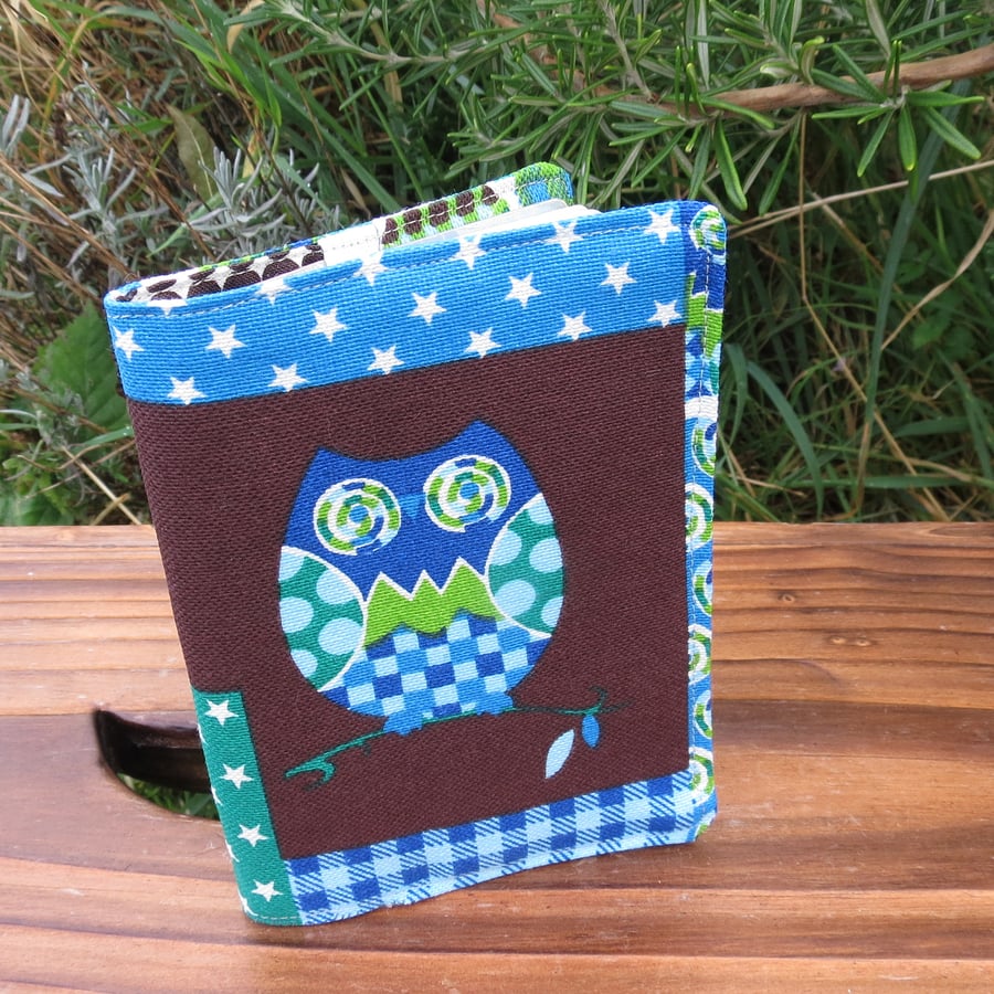Owls.  A fabric passport sleeve with a whimsical owl design.