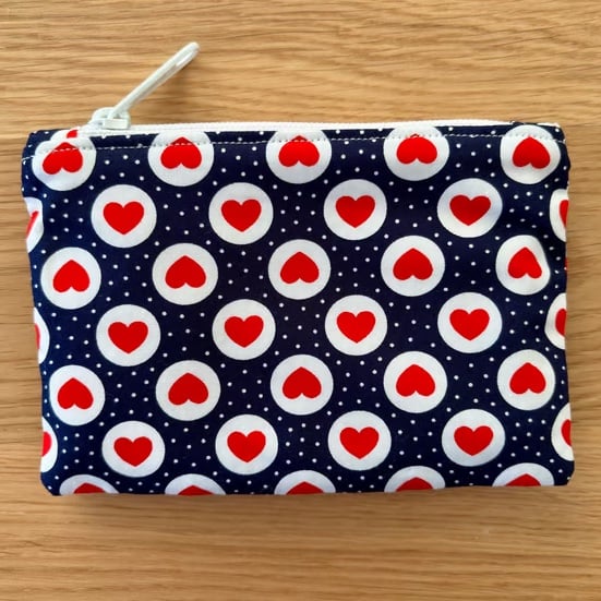 Small zipped fabric purse, pouch, make up bag, in navy with red hearts