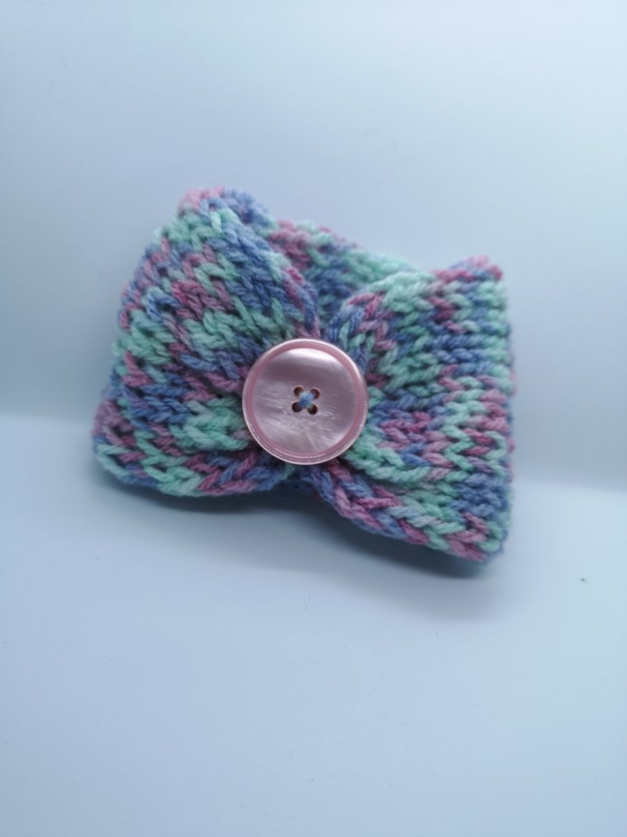 Handknitted pink, purple and mint cup cosie