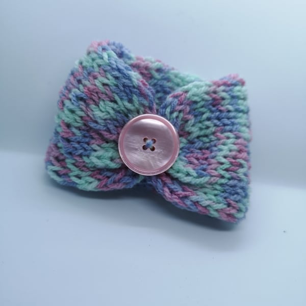 Handknitted pink, purple and mint cup cosie