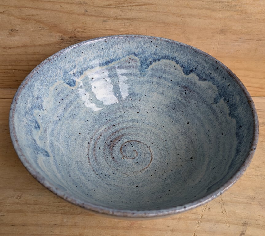 Medium to large sized pale blue wavy textured bowl