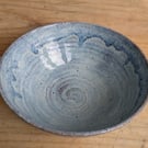 Medium to large sized pale blue wavy textured bowl