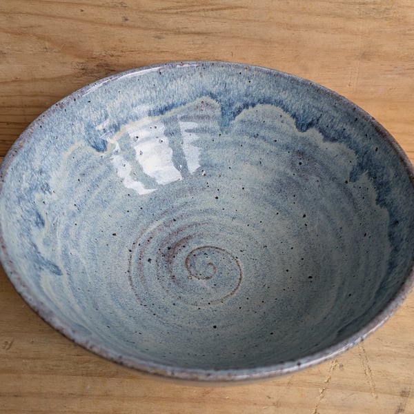 Medium to large sized pale blue wavy textured bowl