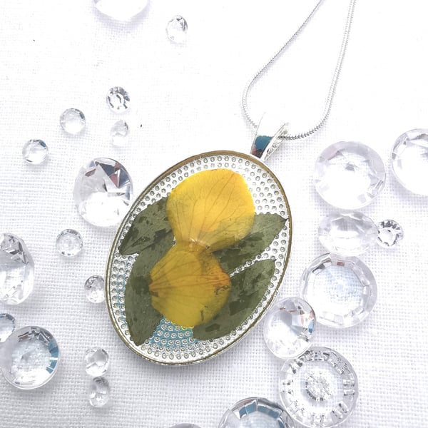 Medium Oval Resin Pendant With Yellow Flower Petals