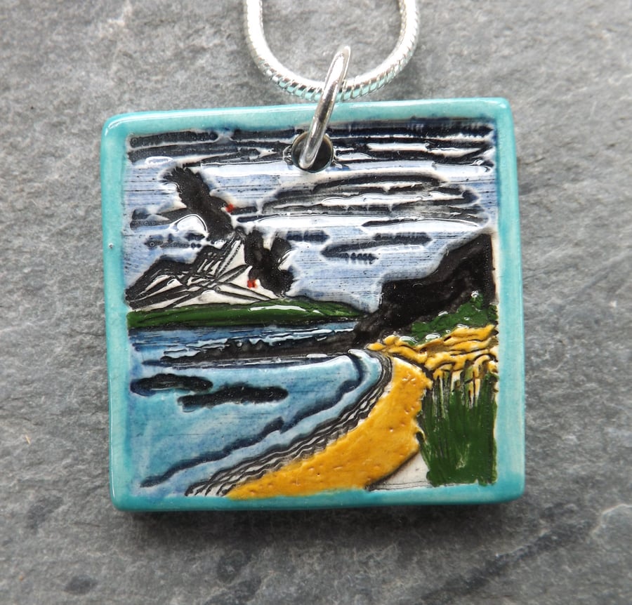 Handmade Ceramic Coastal scene pendant in turquoise