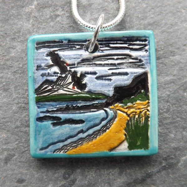 Handmade Ceramic Coastal scene pendant in turquoise