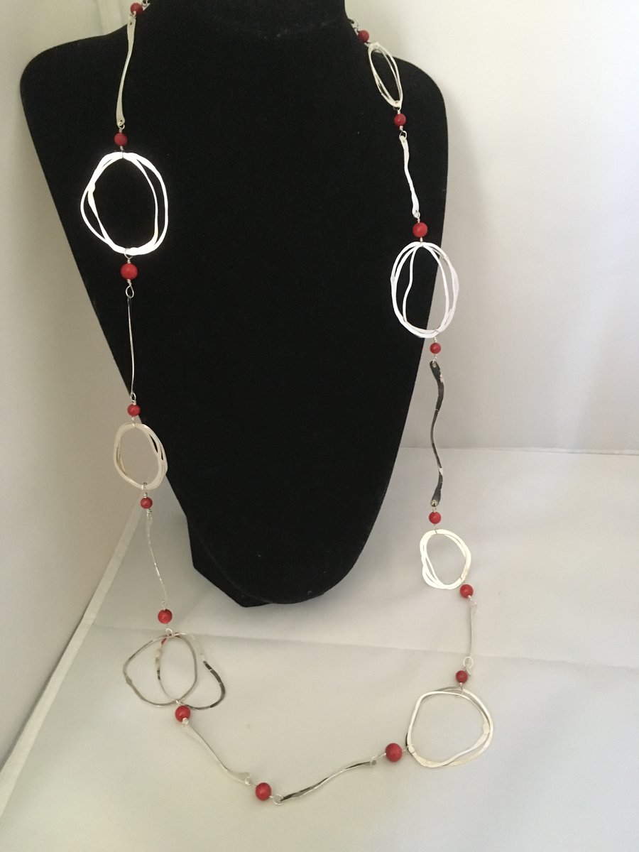 Contemporary long silver and coral necklace
